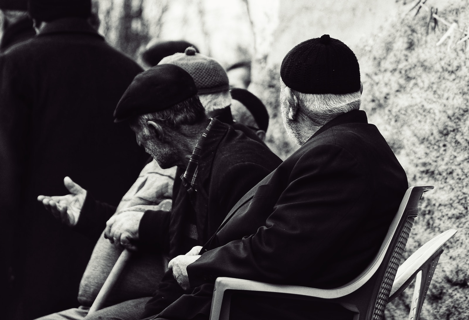 a group of men sitting next to each other