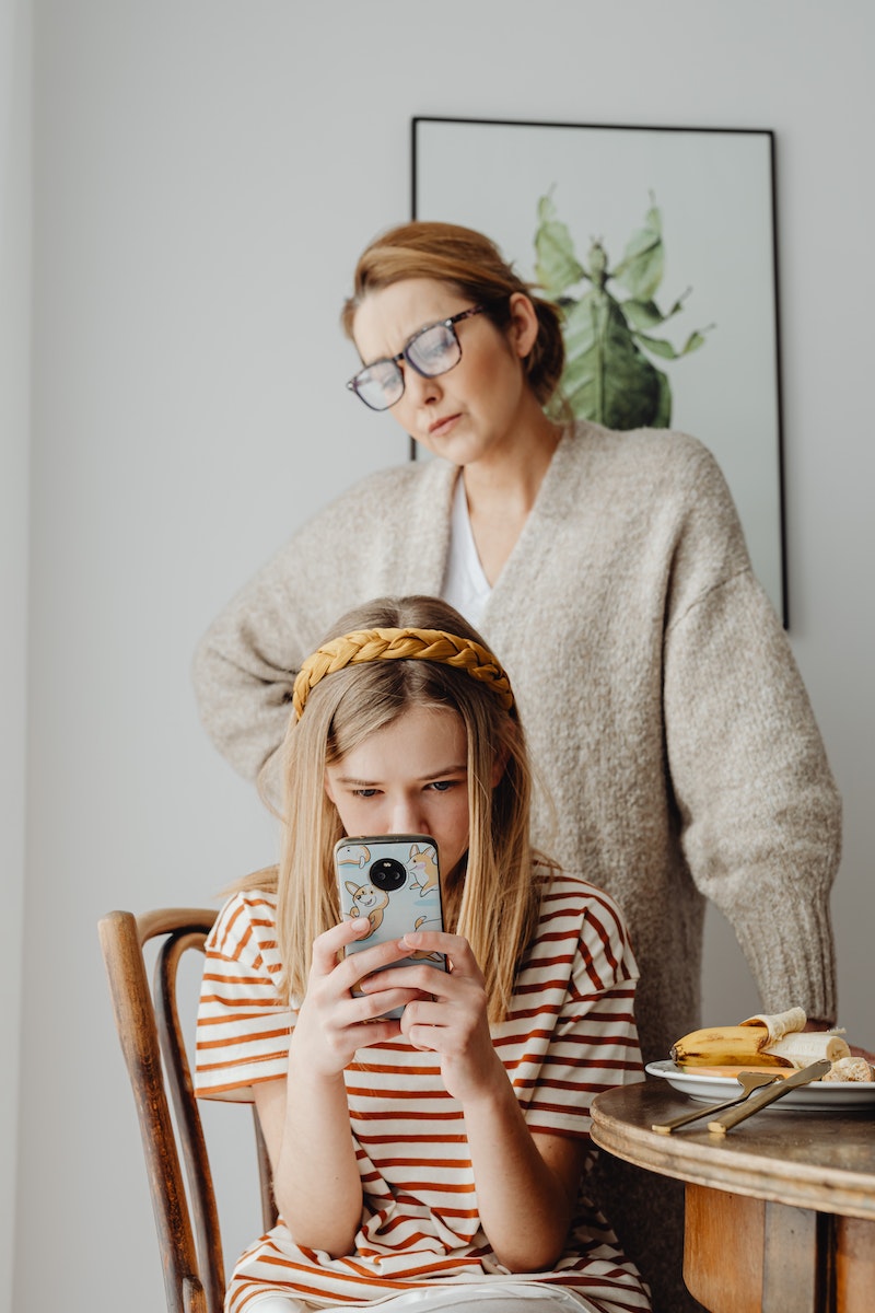 Mother Unhappy with Teen Daughter Using Gadget