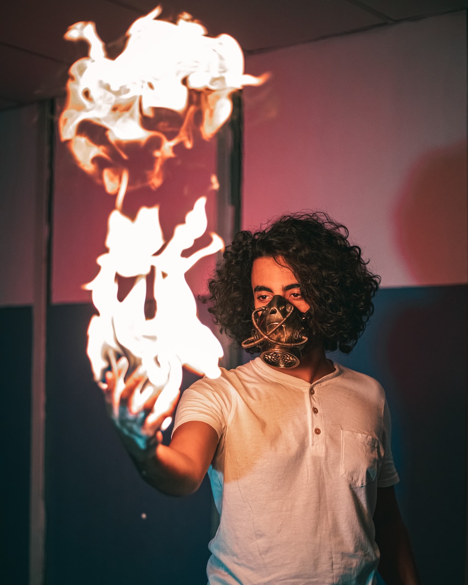 a man holding a fire ball in his hand