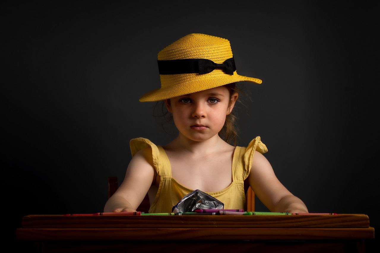 girl, yellow hat, desk