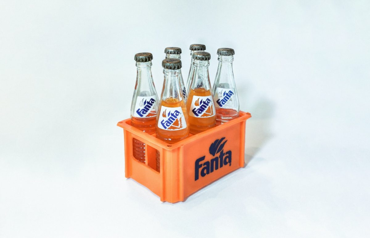 2 coca cola bottles on white surface