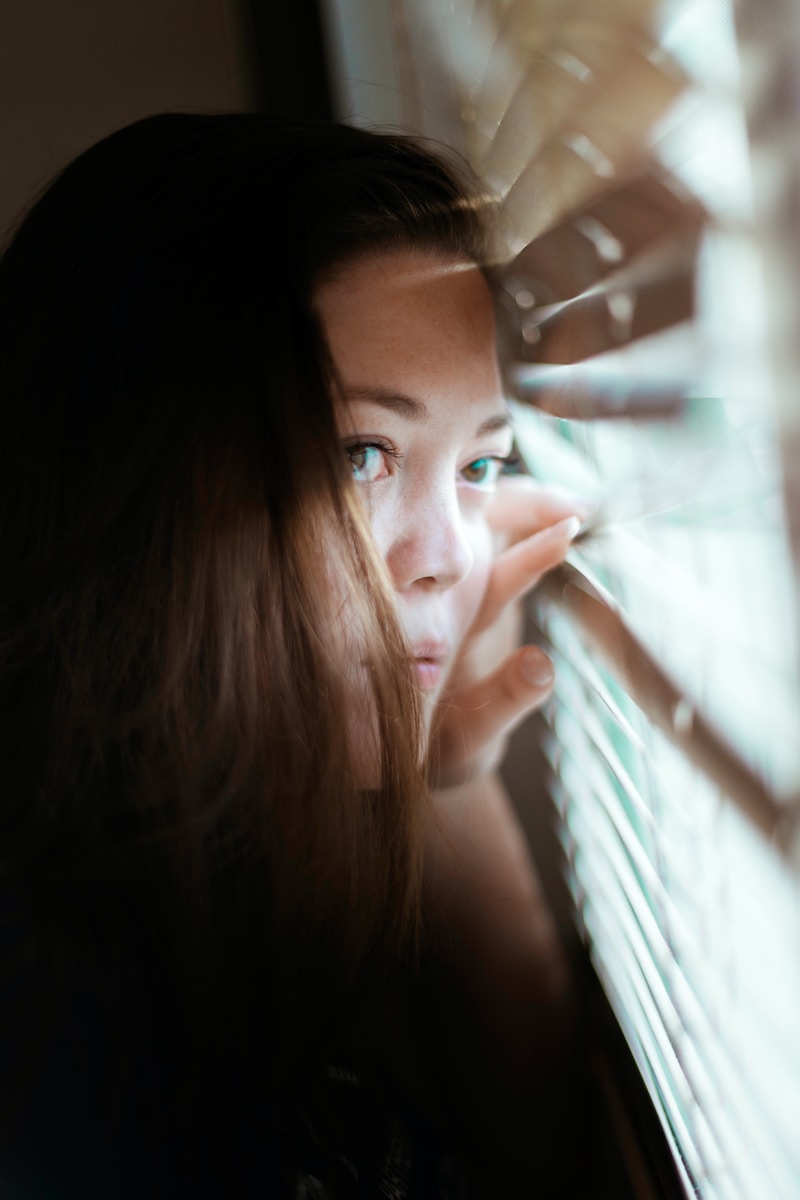 woman looking at the window