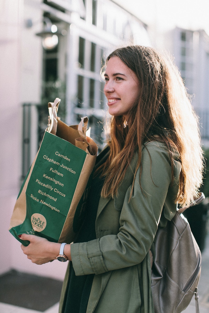 Woman Carrying Paper Bag