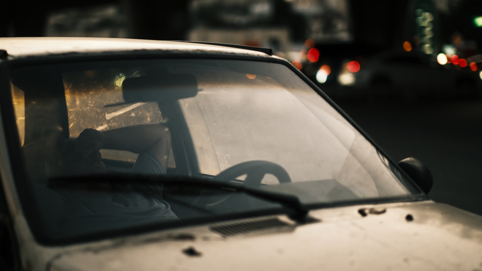 Man Sleeping in Car