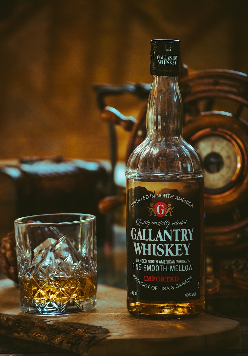 Gallantry Whiskey Bottle Beside Glass