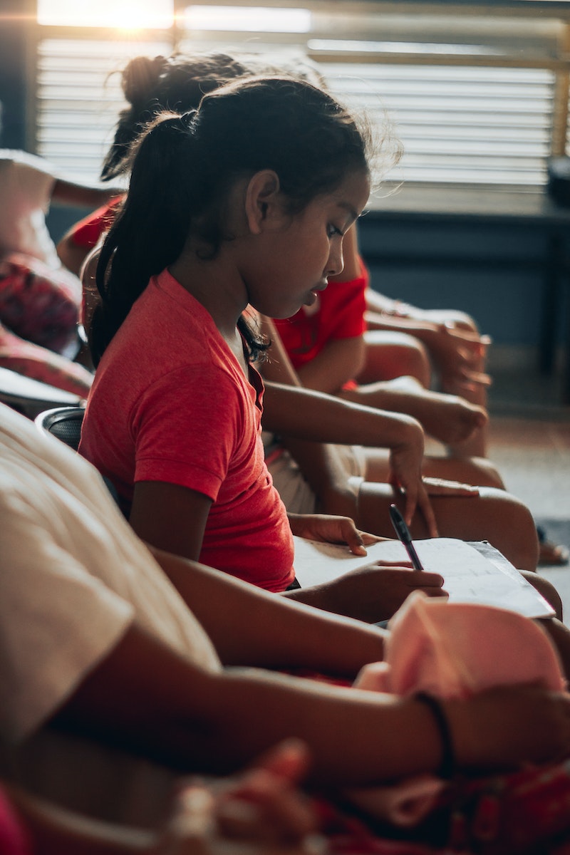 Photo Of A Girl Writing
