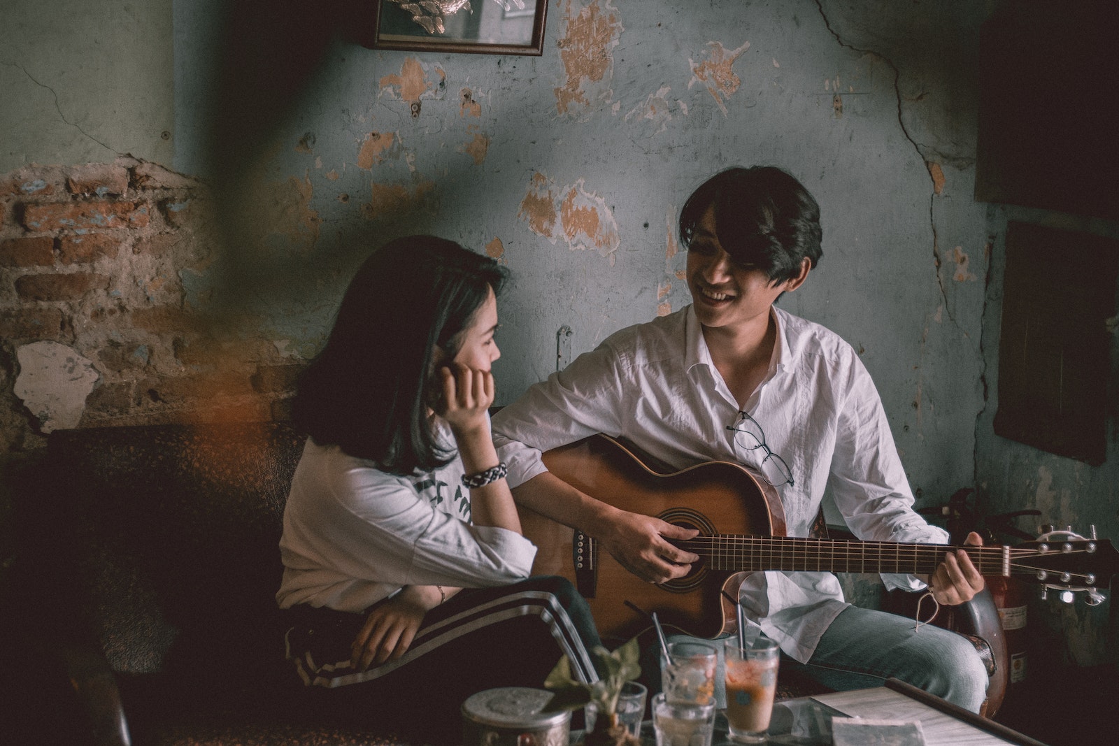 Man Playing Guitar With Girl