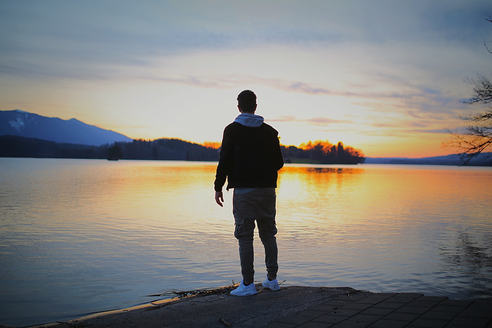 Man Standing on Front Body of Water