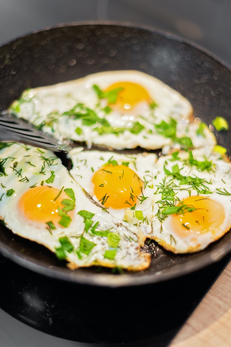 Sunny Side Up Egg on Black Ceramic Plate