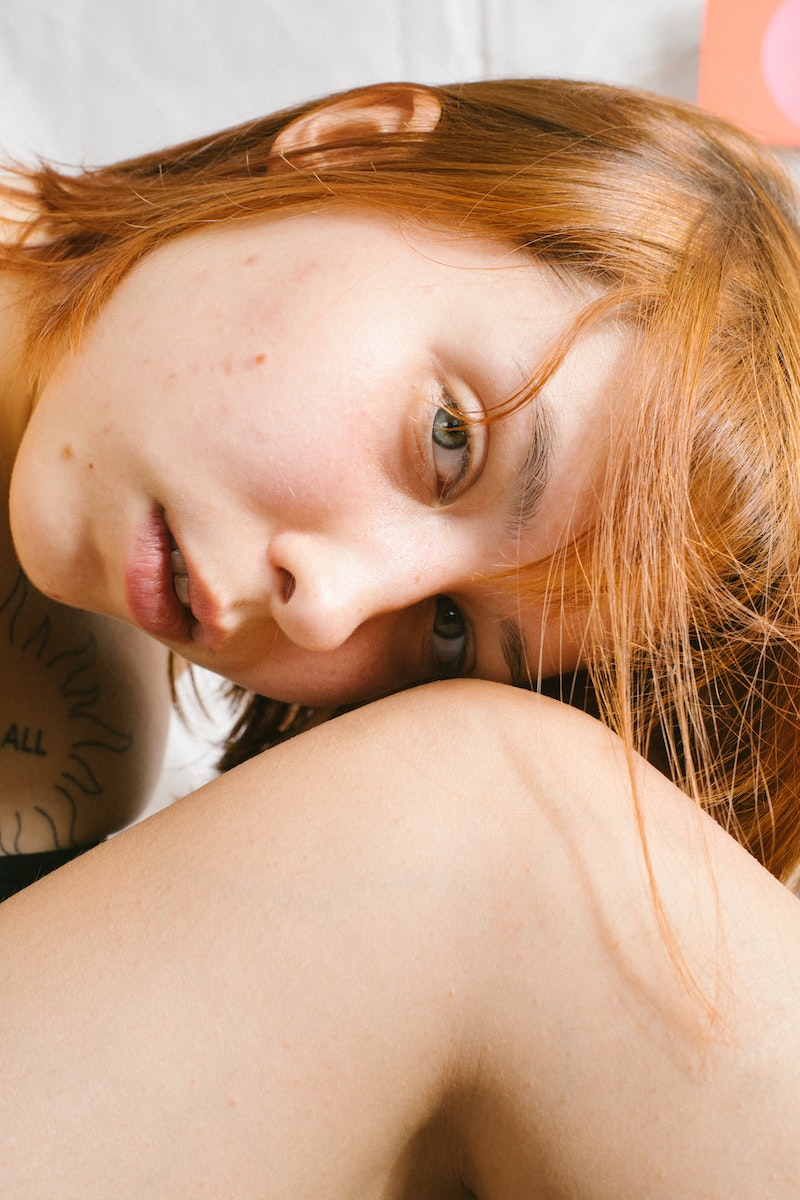 Woman's Head Beside Knee