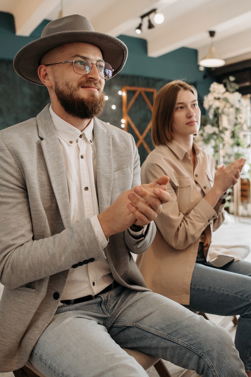 A Man and Woman Clapping Together