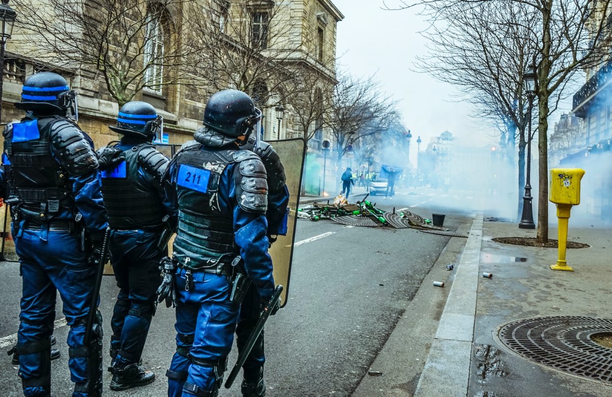 riot police on street with shields