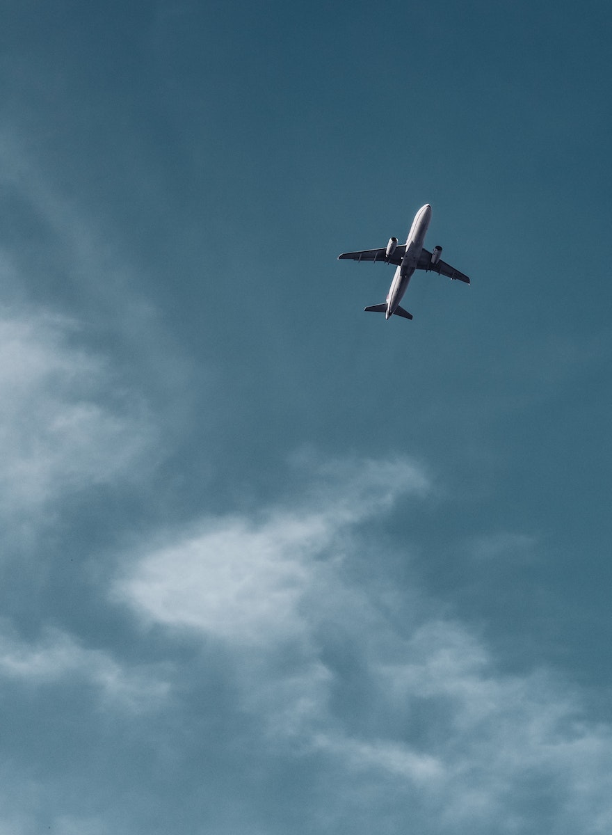 An Airplane Across the Blue Sky