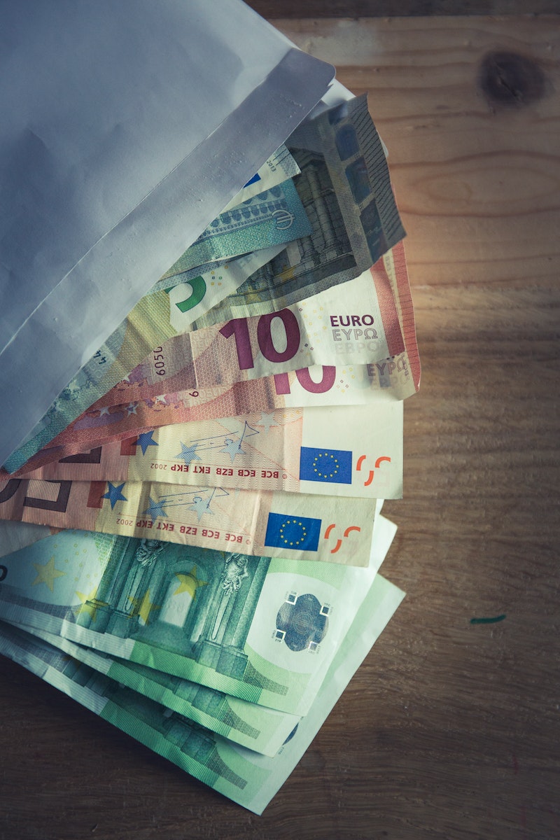 50 Euro Bill on Brown Wooden Table