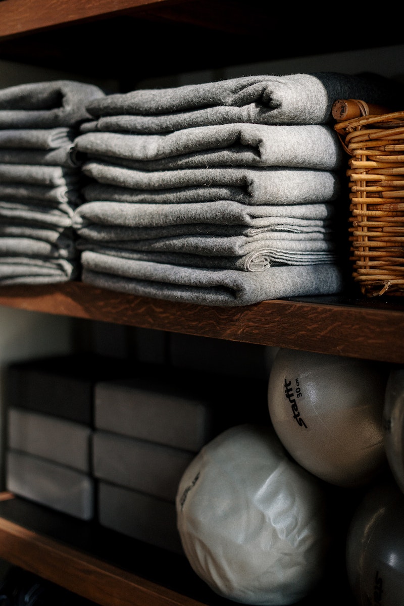Gray Textile on Brown Wooden Shelf