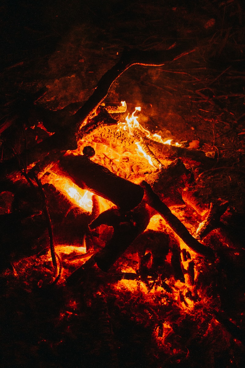 a fire is lit up in the dark