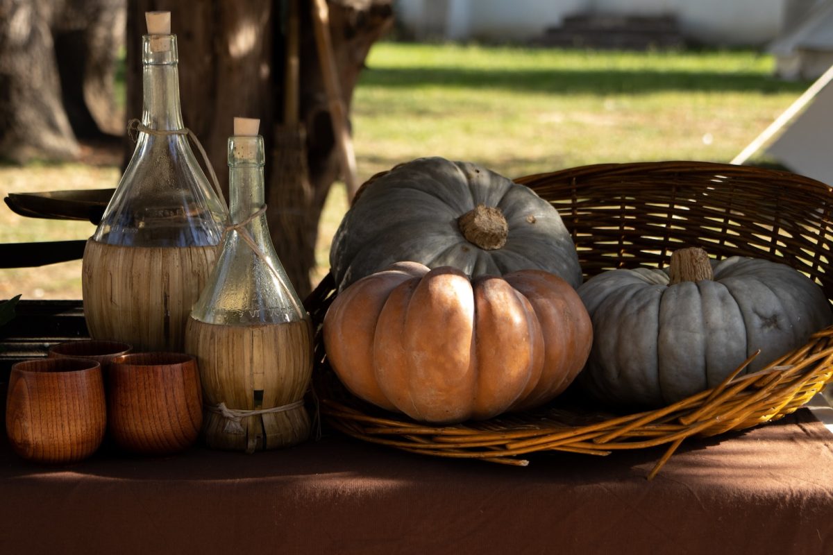a basket of vegetables and a bottle of oil