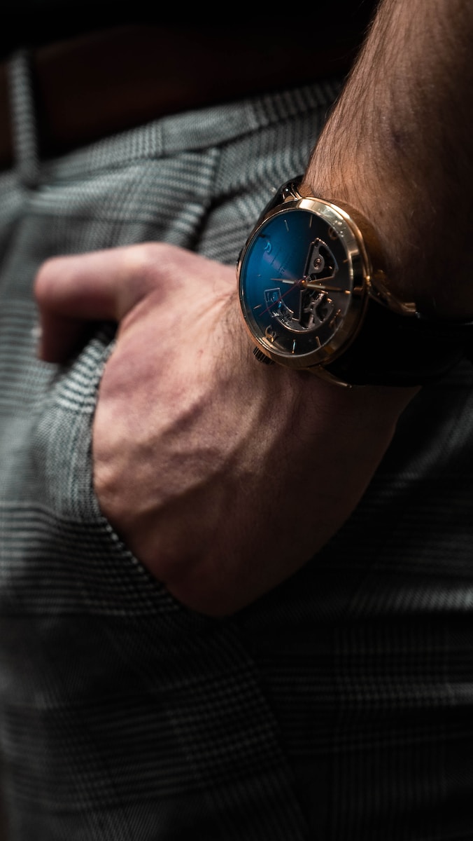 a close up of a person wearing a watch