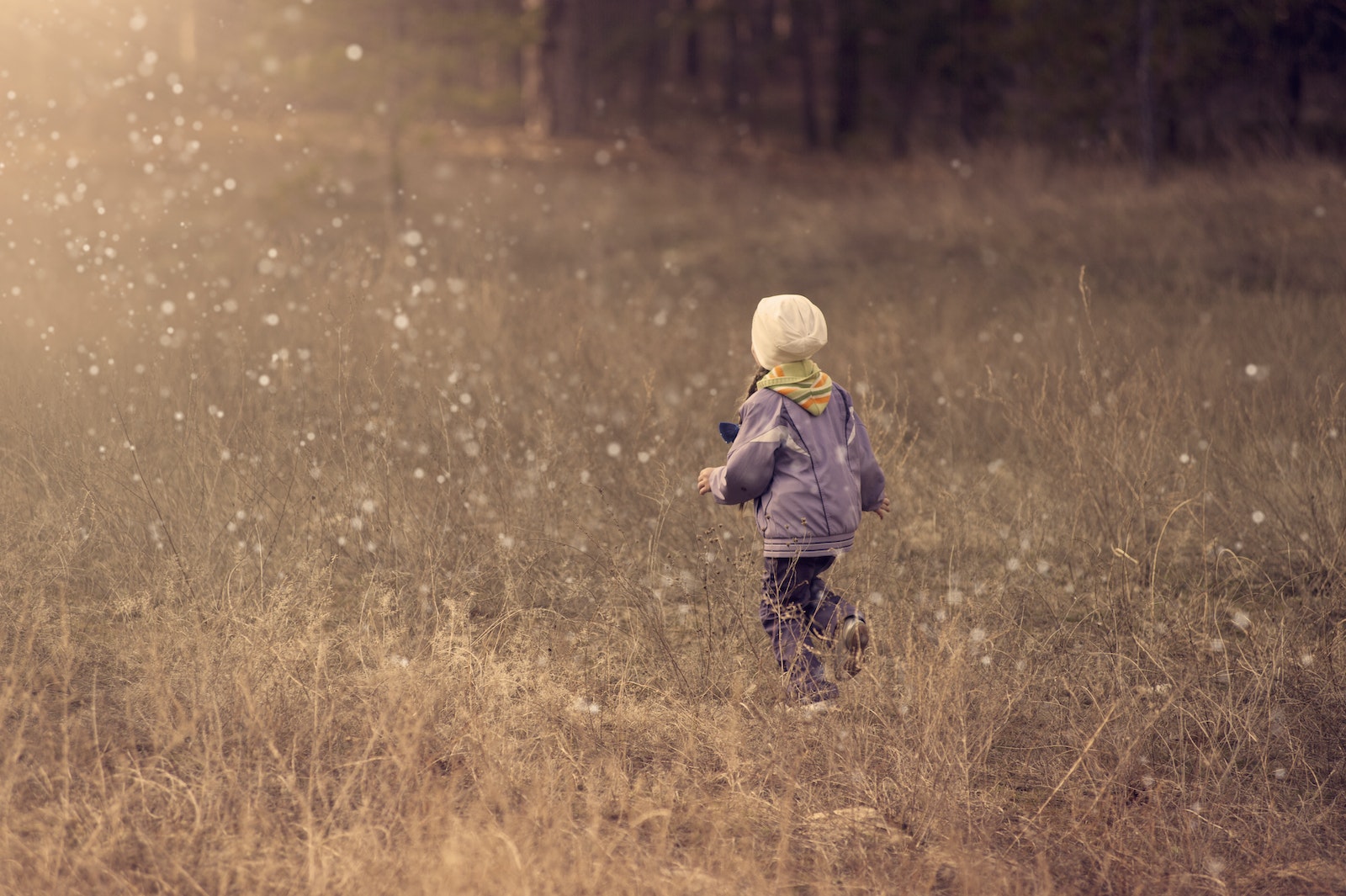 Child Walking on Grass Path