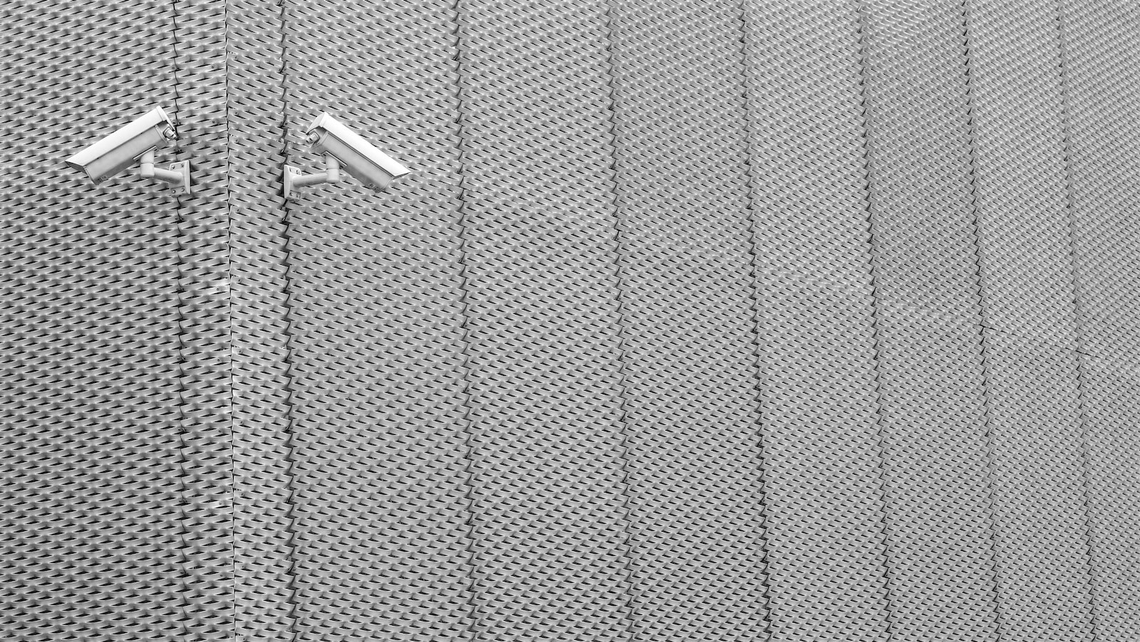 Two Gray Cctv Cameras on Wall