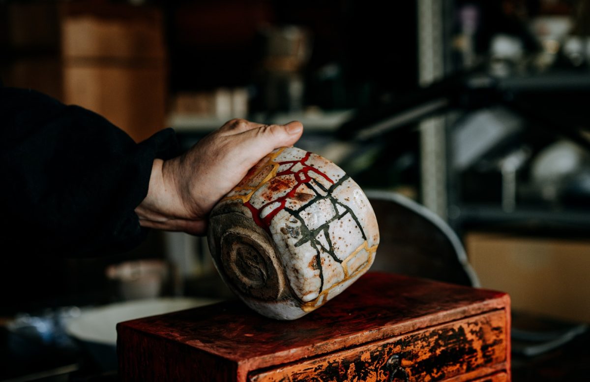 person holding white and blue ball