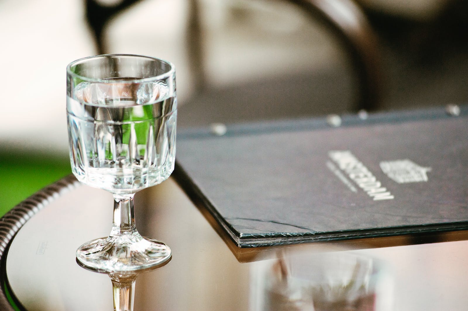 Clear Short-stemmed Glass Beside Menu