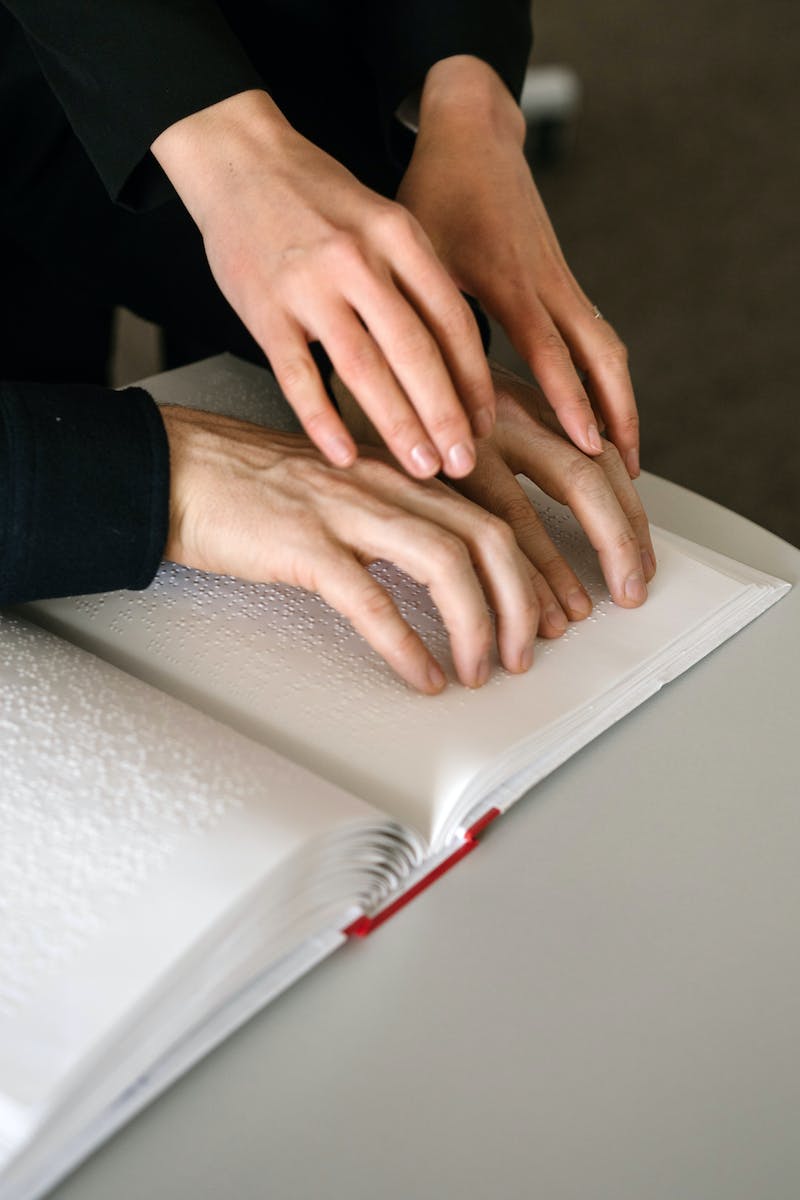 Photo of Person using Braille