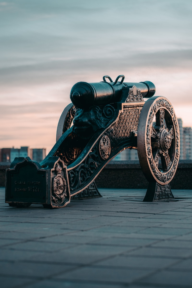 black and gold metal coin operated telescope