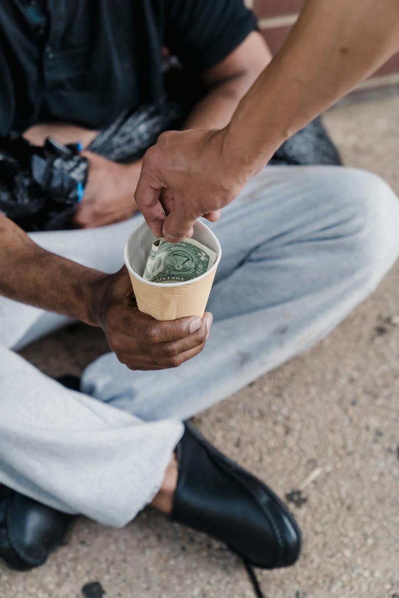 Person Holding Green and White Cup