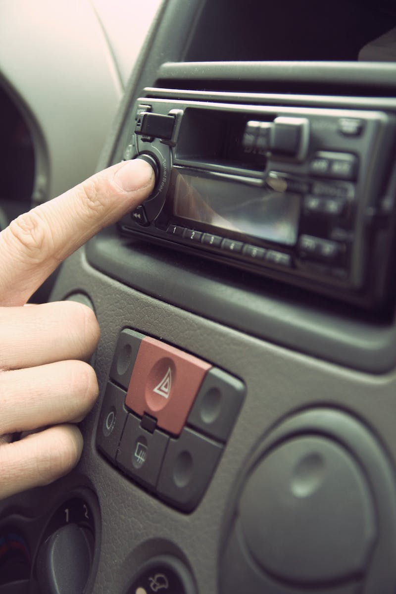 Person Touching 1-din Head Unit Button