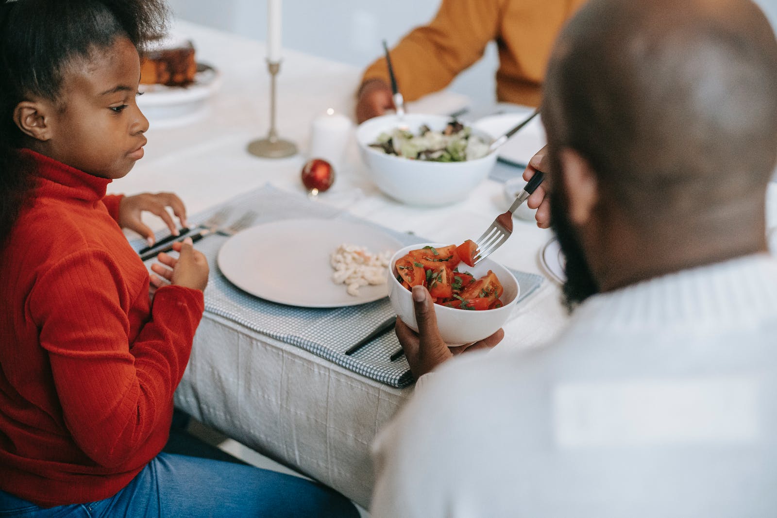 Black family having tasty dinner