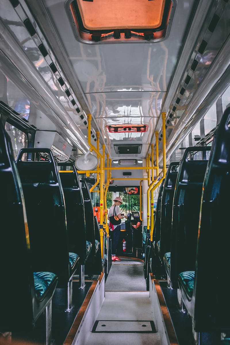 Woman Standing in Bus