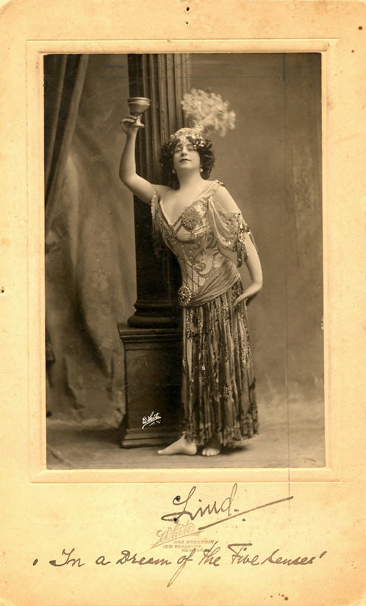 a person holding a glass