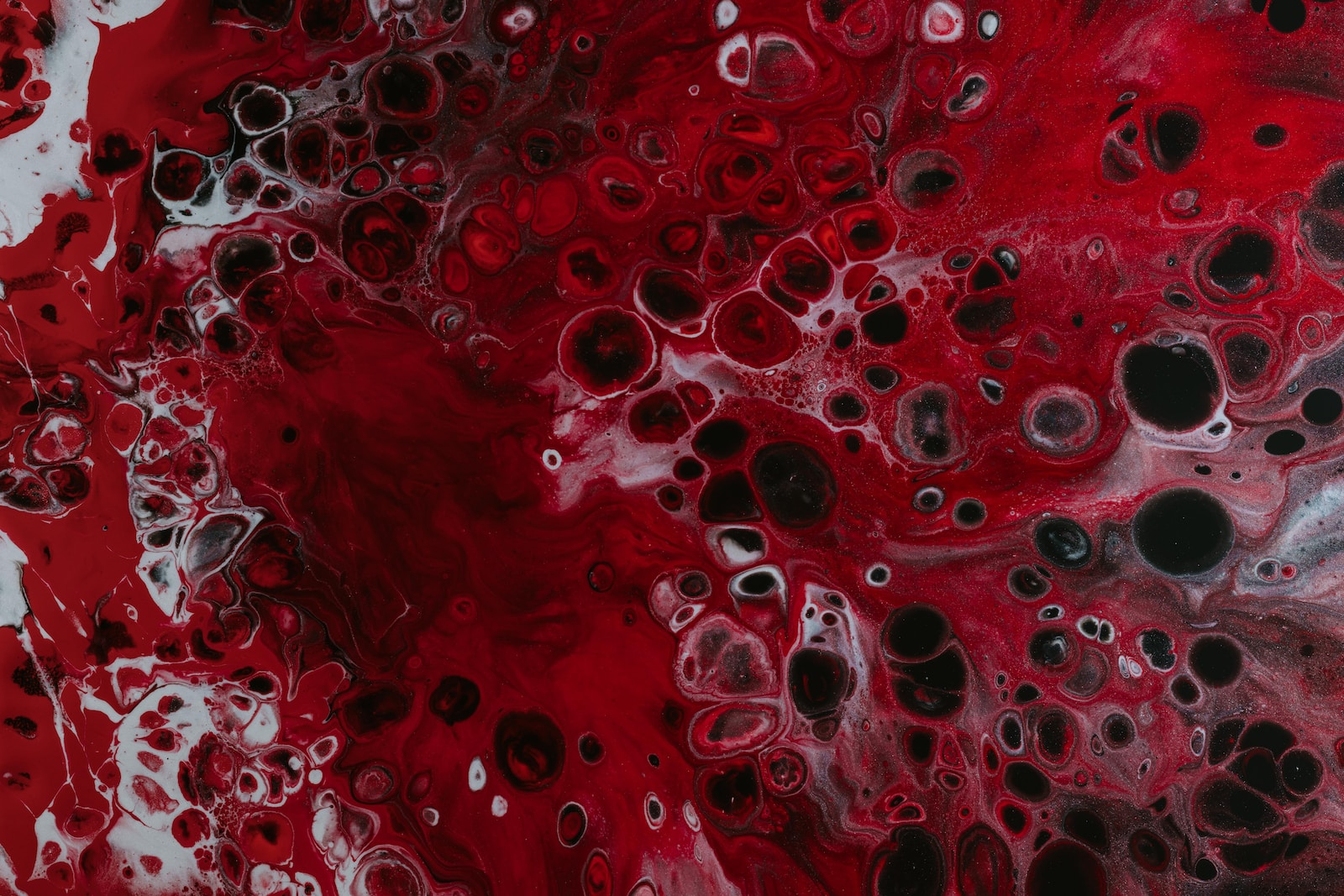 a red and black painting with lots of bubbles