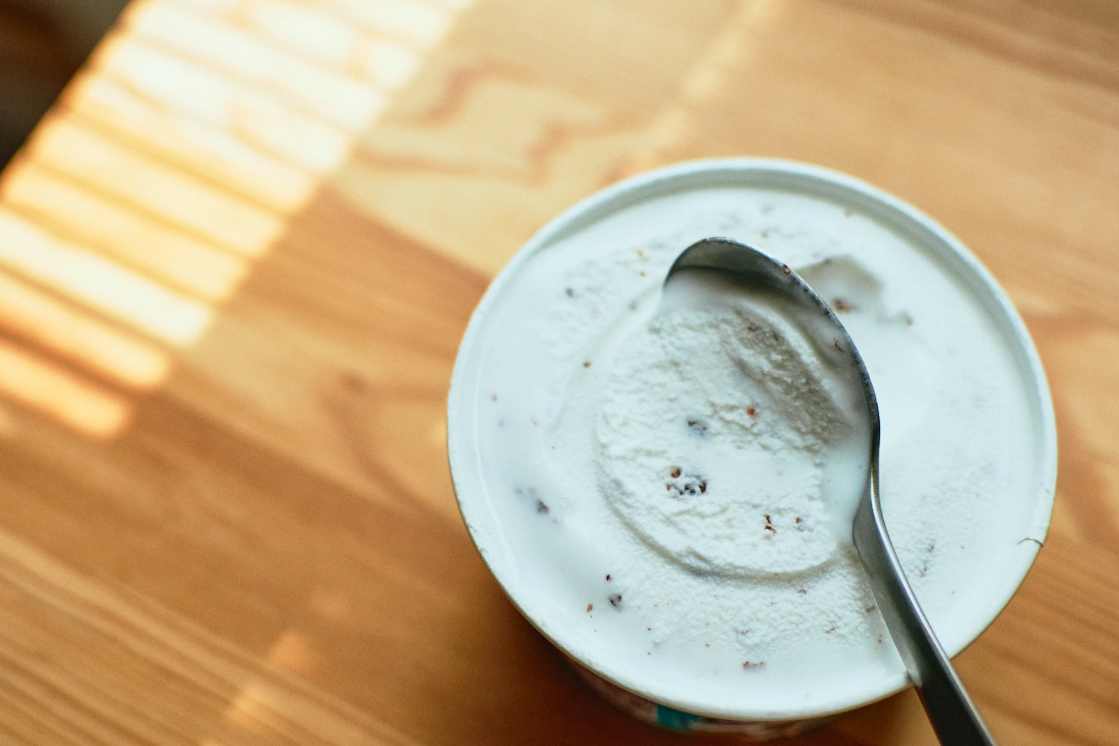 stainless steel spoon on white ceramic plate