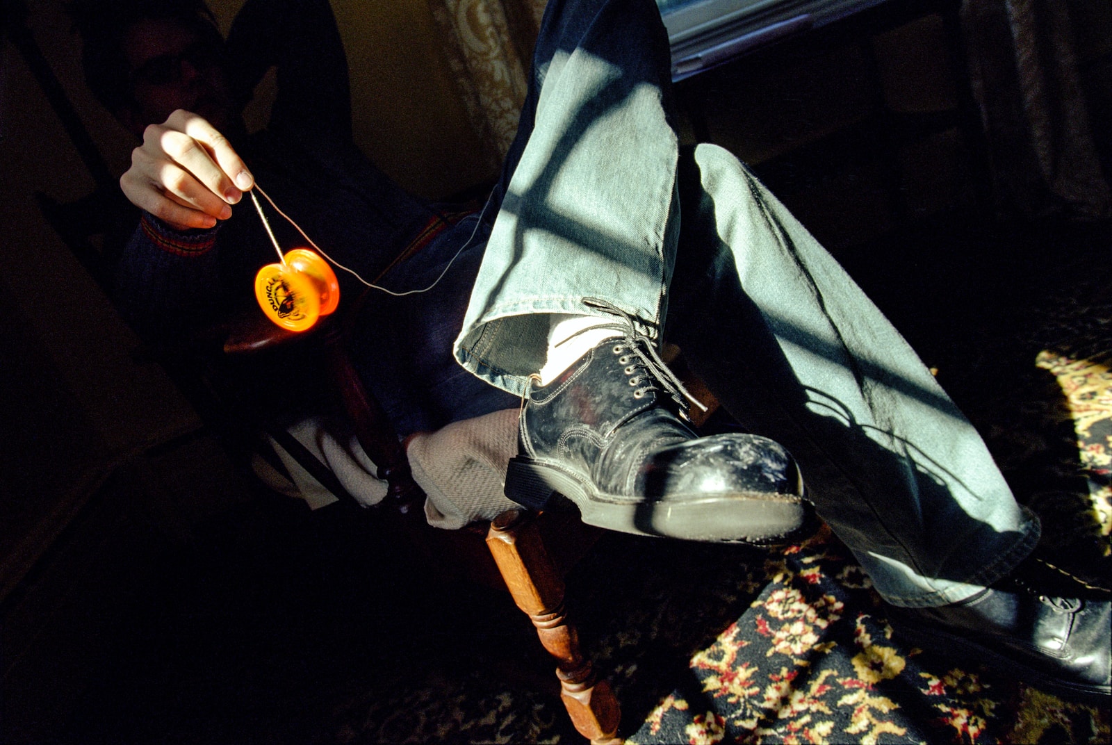 person playing with yellow yo-yo