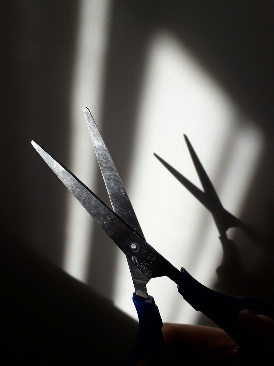 black handle scissors on white surface