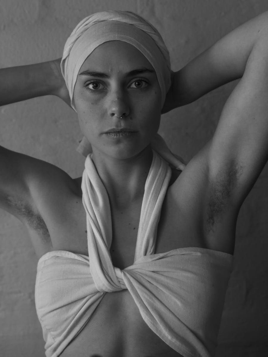 Grayscale Photo of a Woman Wearing a Headwrap