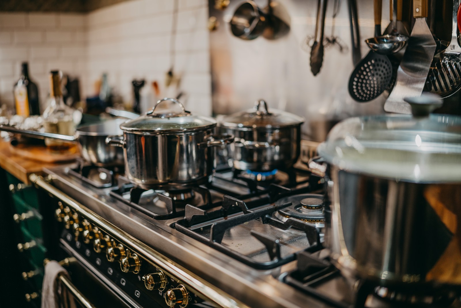 stainless steel cooking pots on gas stove