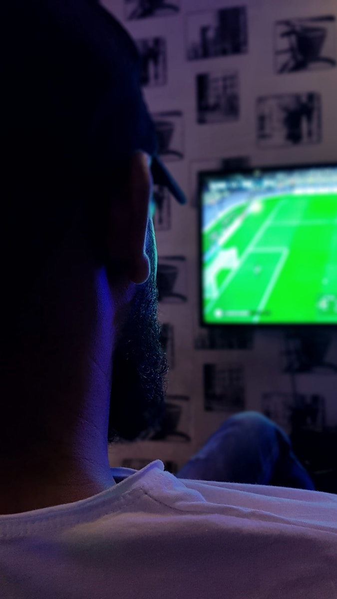 man watching soccer game