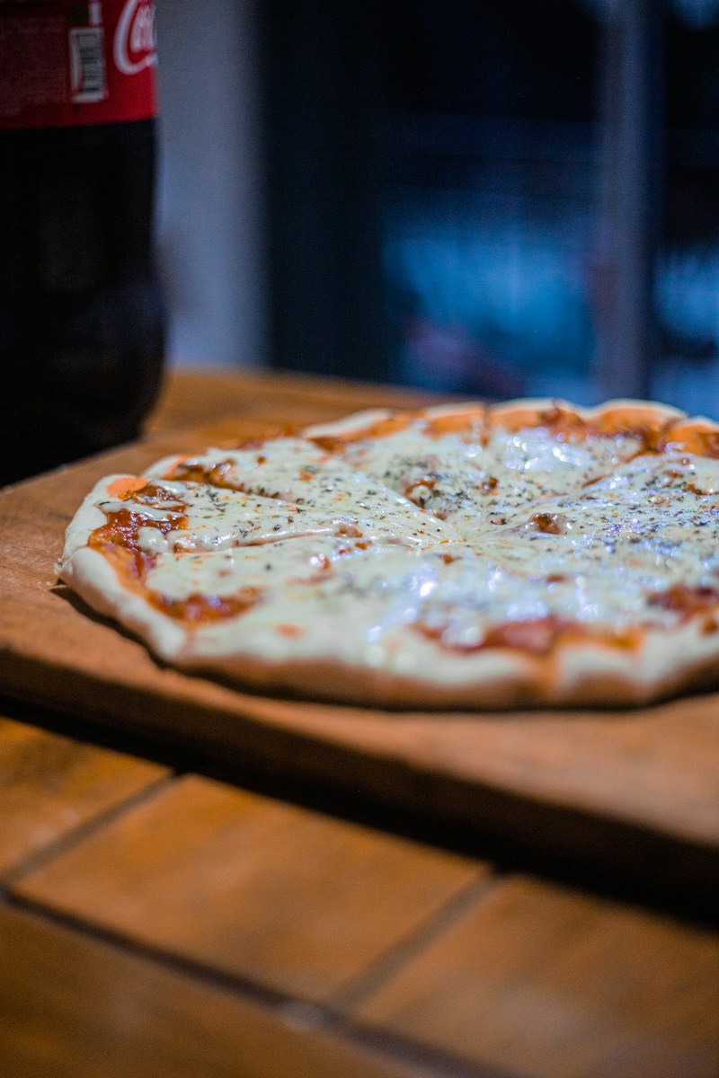 pizza on brown wooden table