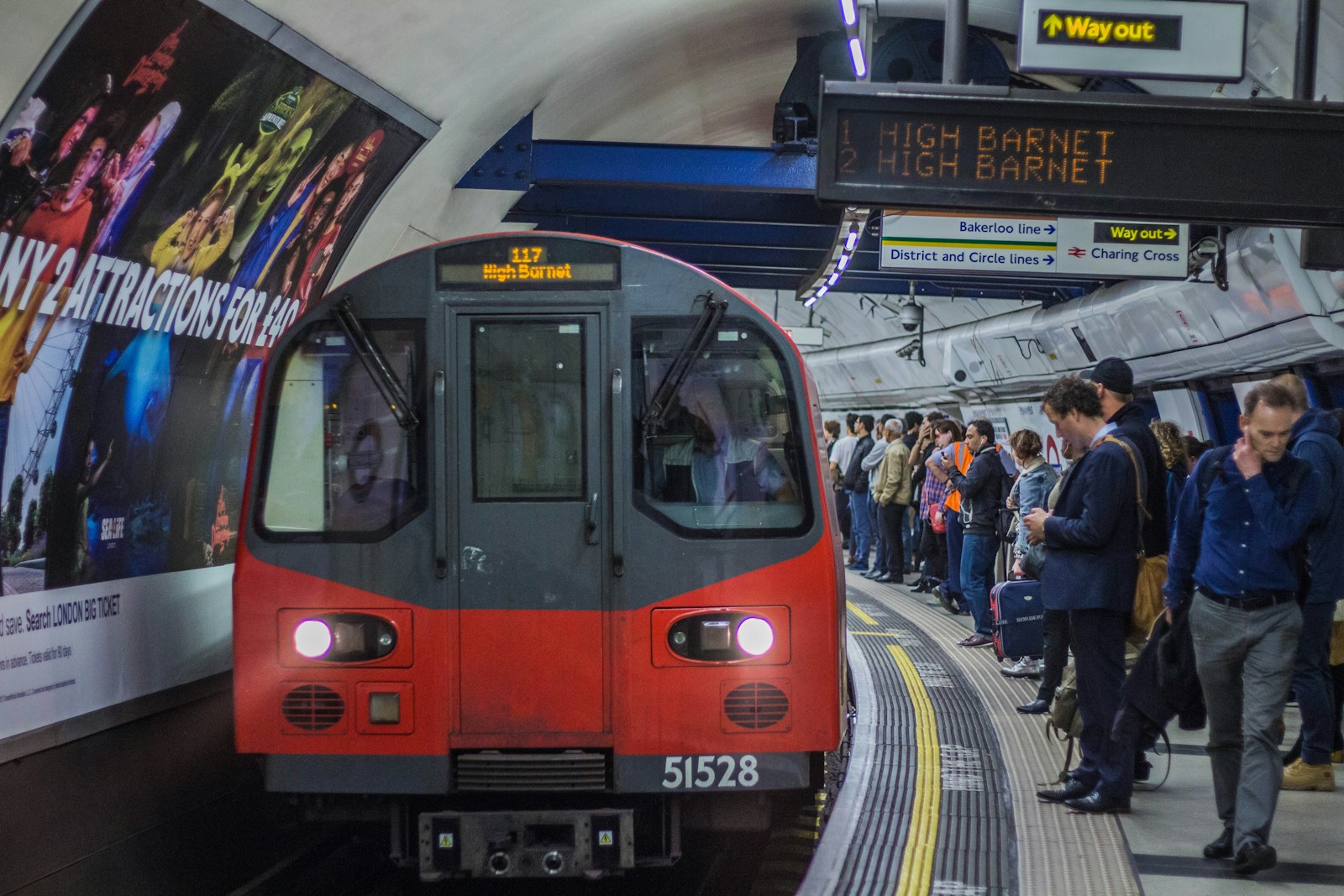 red and black train in the city during daytime