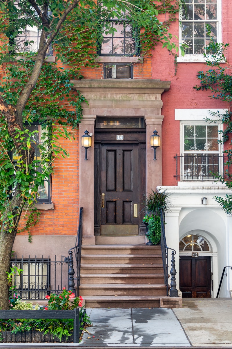 a building with a large door and a staircase